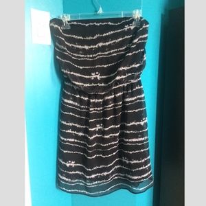 Sheer sleveless black dress w/white stripes